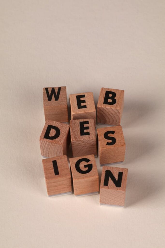 Wooden blocks arranged to spell 'Web Design'. Perfect for creative, digital content themes.